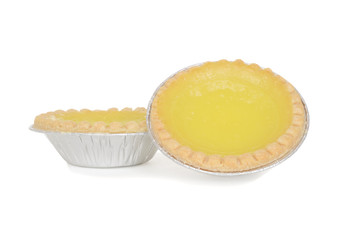 two lemon tarts in foil cup