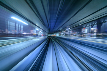 Fototapeta na wymiar Motion blur of train moving inside tunnel in Tokyo, Japan
