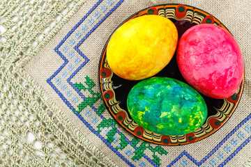 Easter eggs in a plate at the table