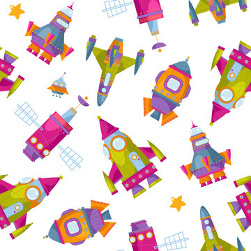 Multi-colored toy space rockets. Spaceships. Seamless background pattern.
