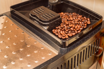 Coffee machine is filled with beans