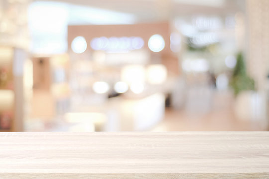 Empty Wooden Table Over Blur Store Background, Product And Food Display Montage Background