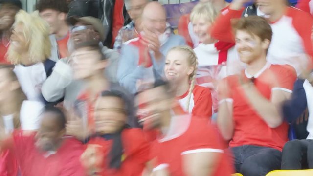  Time lapse of sports fans watching game in stadium & cheering on their team