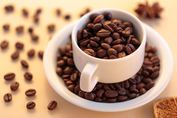 Coffee beans and white cup of coffee