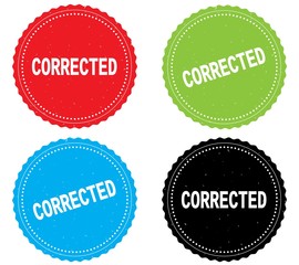 CORRECTED text, on round wavy border stamp badge.