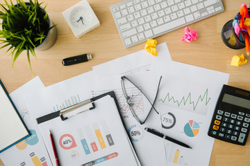 business document in office workplace with computer,flare light,selective focus