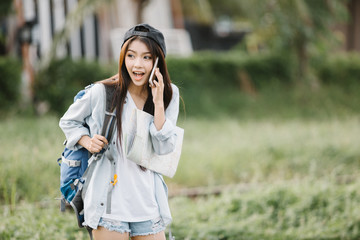 Woman talking with a smart phone in a sunny summer day,travel concept