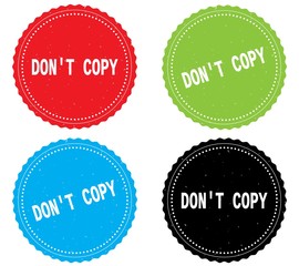 DON'T COPY text, on round wavy border stamp badge.