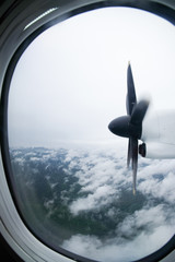 Naklejka na ściany i meble Plane propeller captured while airplane flying