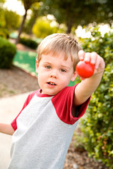 Golf: Little Boy Holds Out Golf Ball