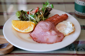 Breakfast with hotdog fried egg and salad