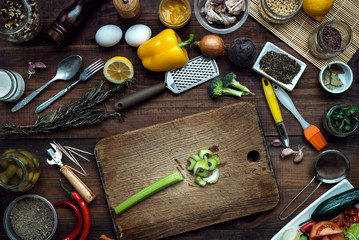 Fototapeta na wymiar Celery stem on wooden kitchen table with vegetables cooking ingredients 
