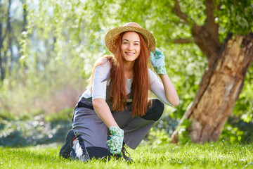 Young beauty at gardening
