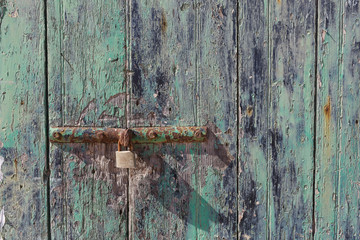 Rusty hinge of a wooden door