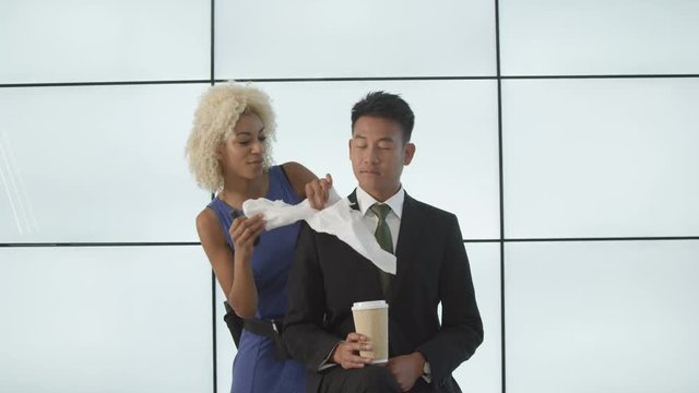  Make up artist preparing tv presenter before he goes on air