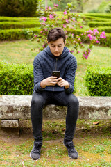 Obraz premium Cool teenager with fifty years old and a mobile