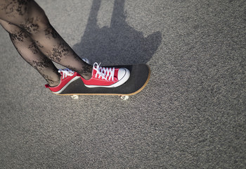 Image of a young skater girl skateboarding