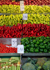 Variety of peppers for sale at an open-air market
