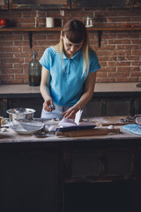 Young smiling woman cooking holiday pie