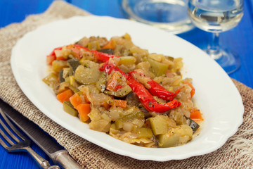 vegetable stew on white dish on wooden background
