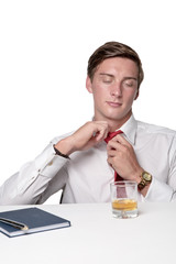 business man drinking alcohol at work