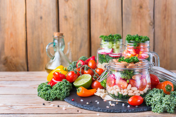 Healthy vegan salad in a mason jar with beans