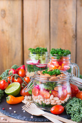 Healthy vegan salad in a mason jar with quinoa