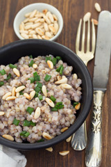 boiled buckwheat in black bowl