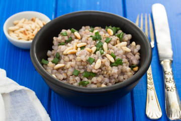 boiled buckwheat in black bowl