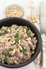boiled buckwheat in black bowl