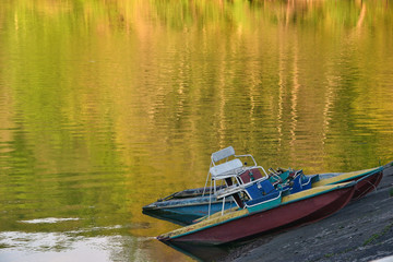 Fototapeta premium Two old catamarans on the shore of the lake
