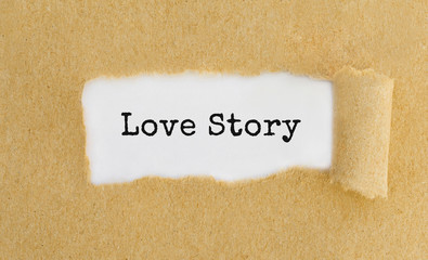 Text Love Story appearing behind ripped brown paper.