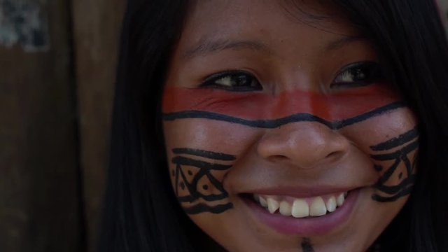Closeup face of Native Brazilian Woman at an indigenous tribe in the Amazon
