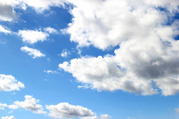 Naklejka na ściany i meble White and gray clouds float on the blue sky