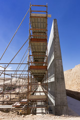 Reinforced concrete wall and scaffolding