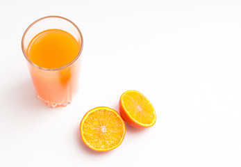 Orange juice in a glass cup, isolated on white background, 