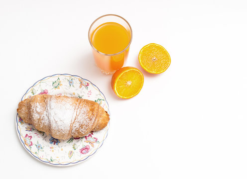 Orange juice in glass jar, on white background and Croissant, isolated 