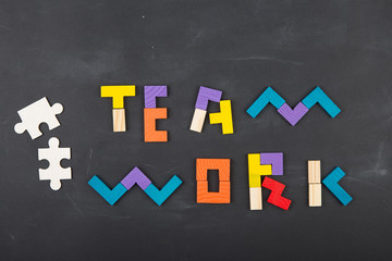 Teamwork creative concept concept jigsaw on the blackboard
