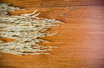 ear of rice on wooden board