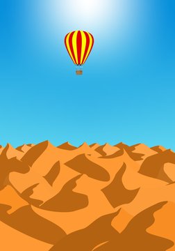 Summer holiday desert landscape with brown sand dunes with red hot air baiioon in the blue sky. Air transport at sunset 