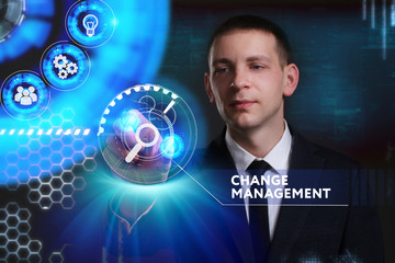 Business, Technology, Internet and network concept. Young businessman working on a virtual screen of the future and sees the inscription: Change management