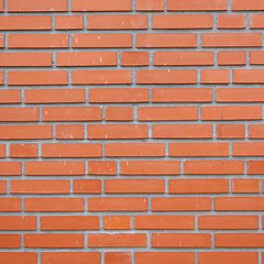 square part of orange brick wall