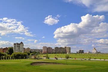 Fototapeta na wymiar Golf Park with City View