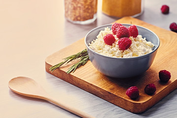 Diet curd with raspberry in a cup.