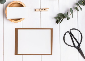 Blank card and paper on the wooden table
