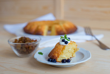 Cottage cheese baked pudding, sour cream and blueberries