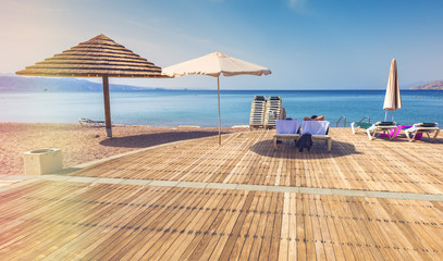 Wooden terrace on central public beach in Eilat - famous resort in Israel and Middle East