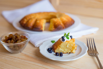 Cottage cheese baked pudding, sour cream and blueberries
