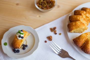 Cottage cheese baked pudding, sour cream and blueberries
