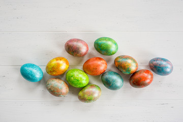 Easter eggs on white wooden background